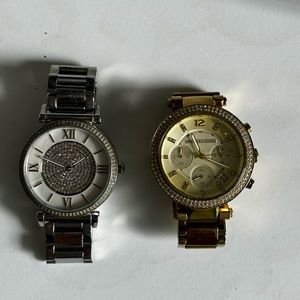 One silver and one gold Michael Kors watch